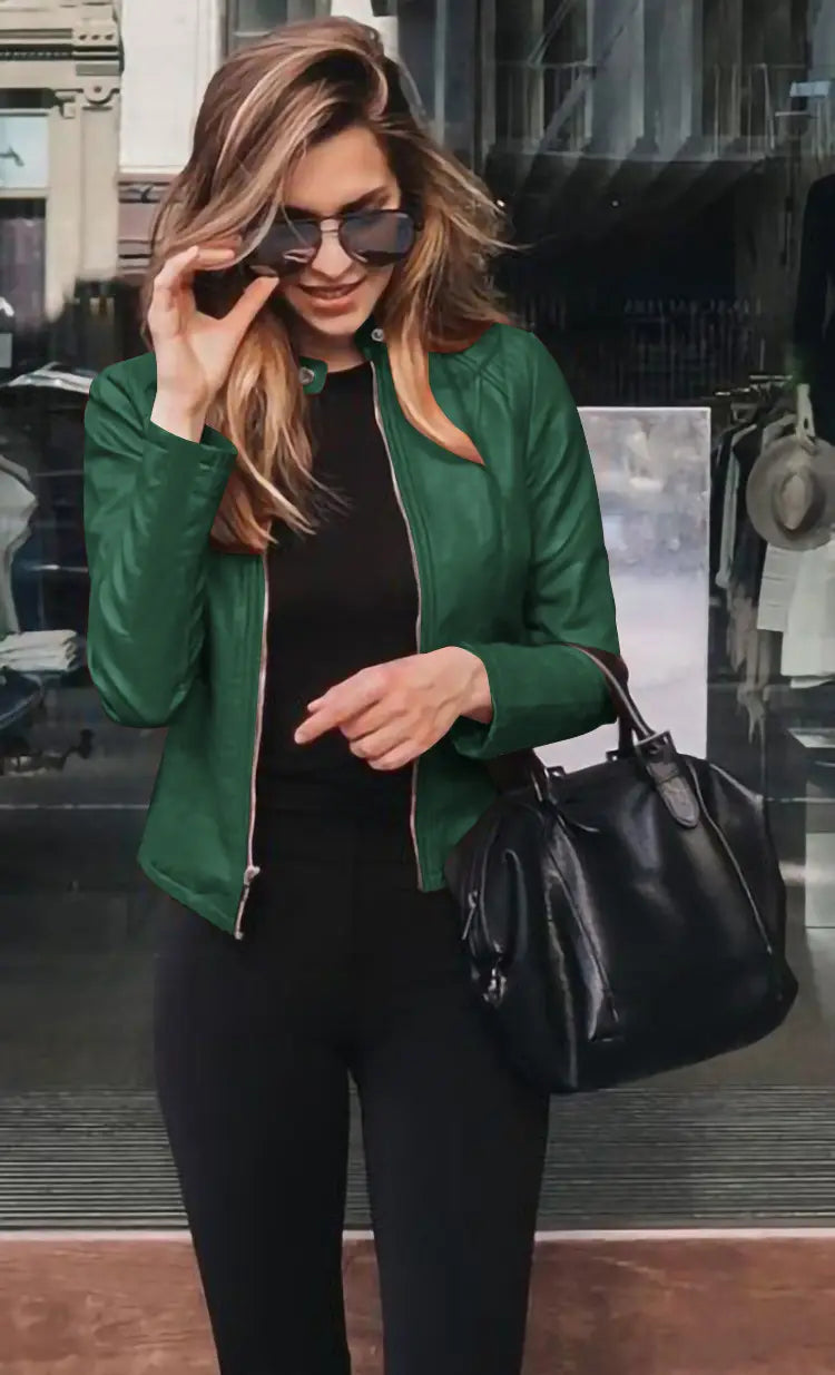 Green faux leather bomber jacket fitted with a front zipper and snap buttons for a zip up coat style.