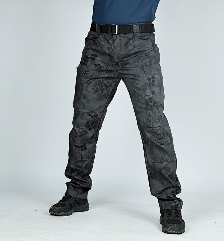 Ix7 men’s tactical cargo pants in dark gray featuring a subtle snake-scale camouflage pattern made from durable fabric with multiple cargo pockets and reinforced stitching for army training use.