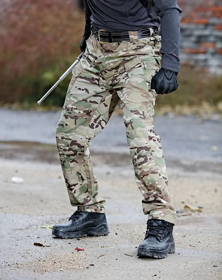 Ix7 men’s tactical cargo pants in multicam pattern with reinforced stitching and multiple cargo pockets designed for army training trousers.