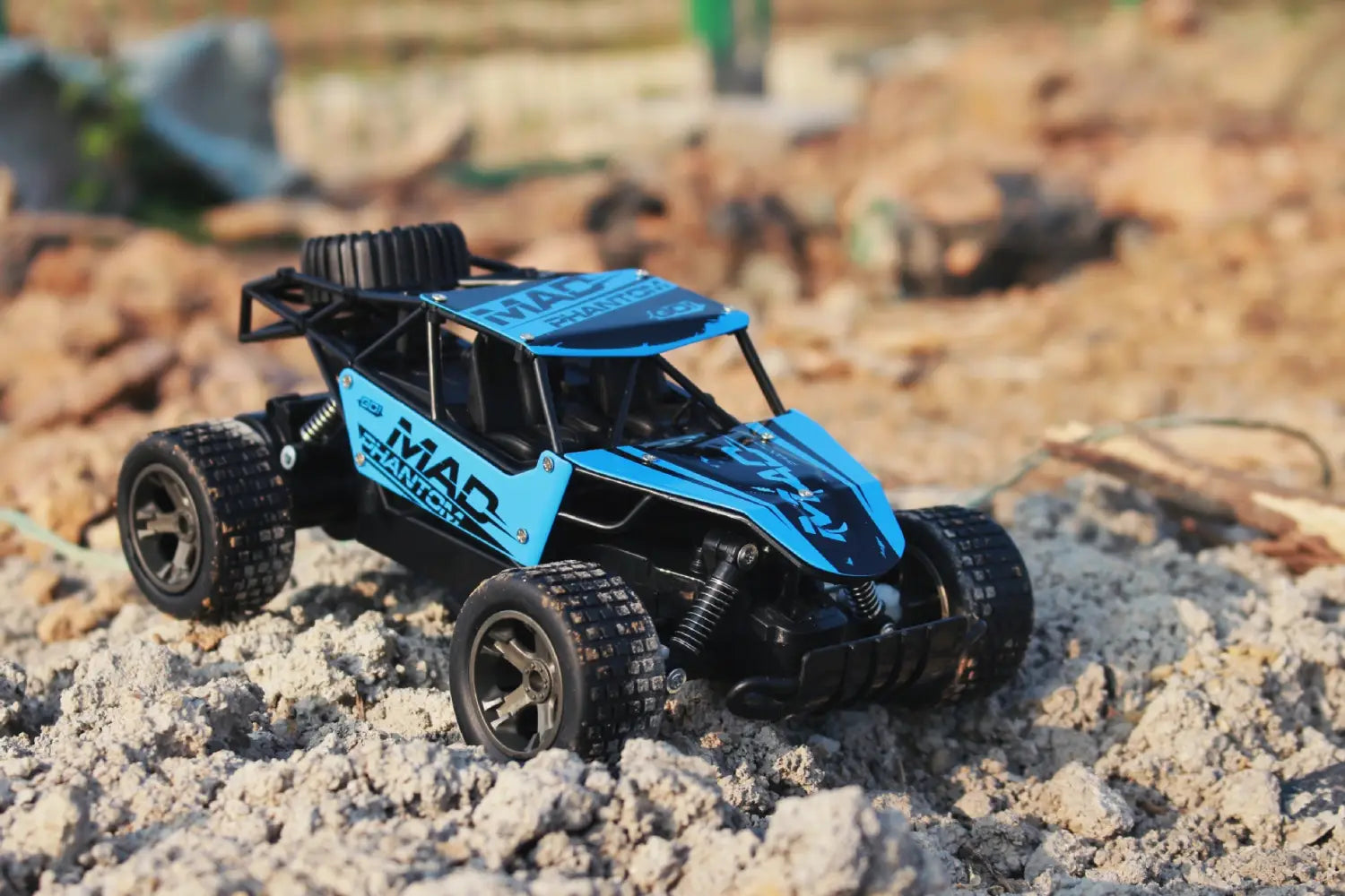 Blue and black remote-controlled off-road buggy with mad phantom branding designed for 2.4g rc drift car use.