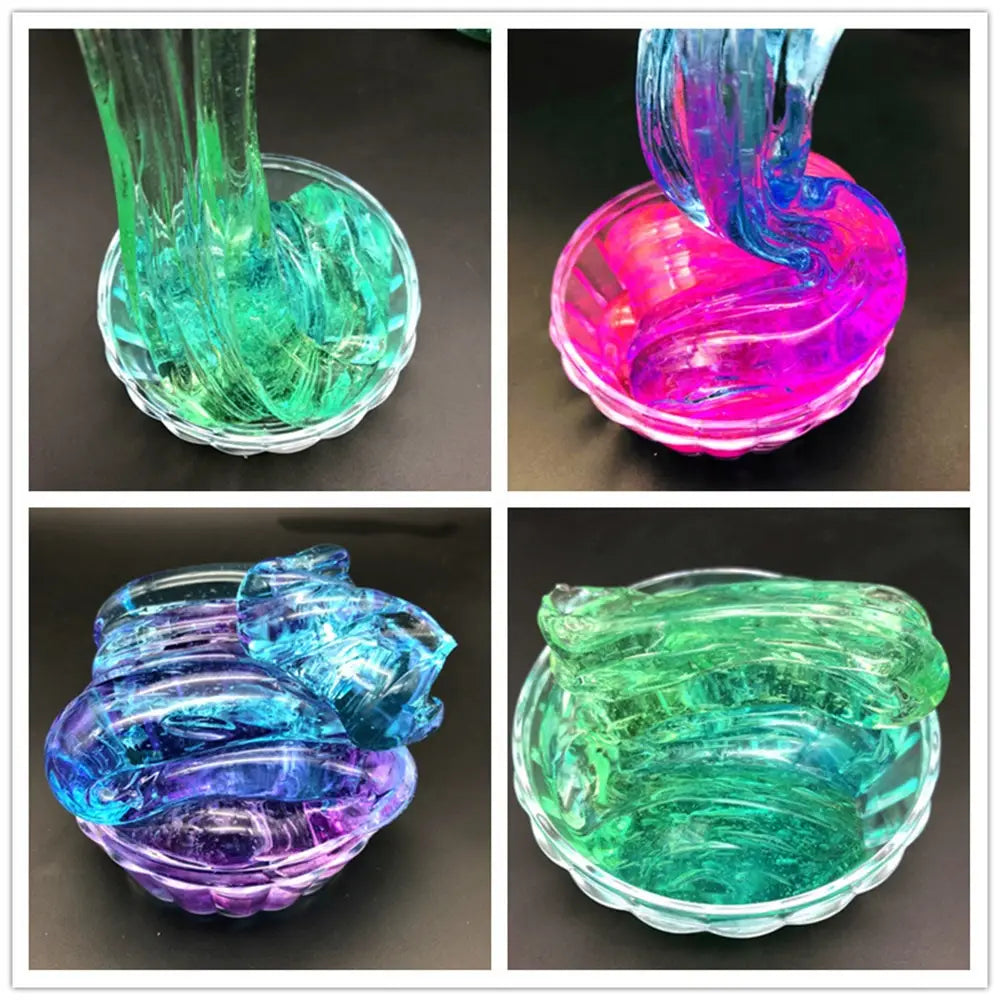 Vibrant translucent gradient crystal mud slime and putty toy in blue and purple displayed in clear glass bowls alongside assorted green and pink colors.