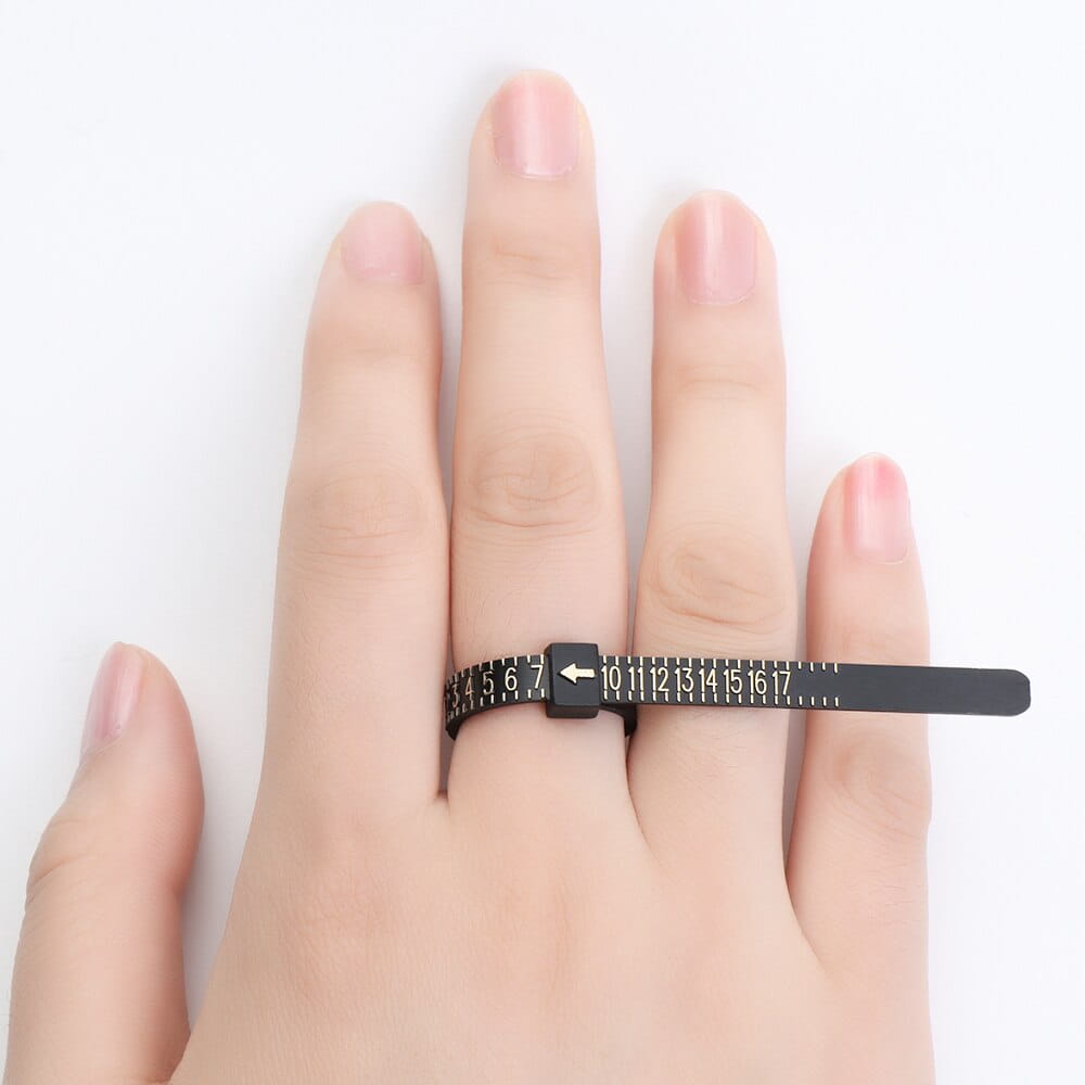professional multi scale ring and bracelet sizer gauge tool featuring a black metal ring sizer with white numerical markings and a small arrow indicator.