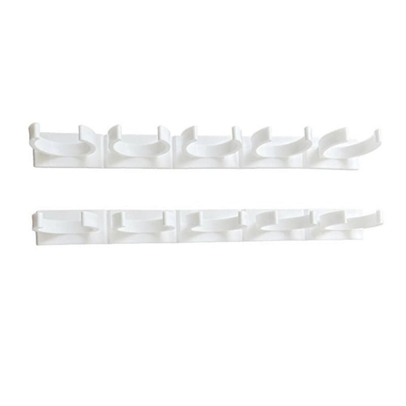white plastic wall-mounted coat rack with six evenly spaced hooks designed as a spice rack organizer with adhesive clips