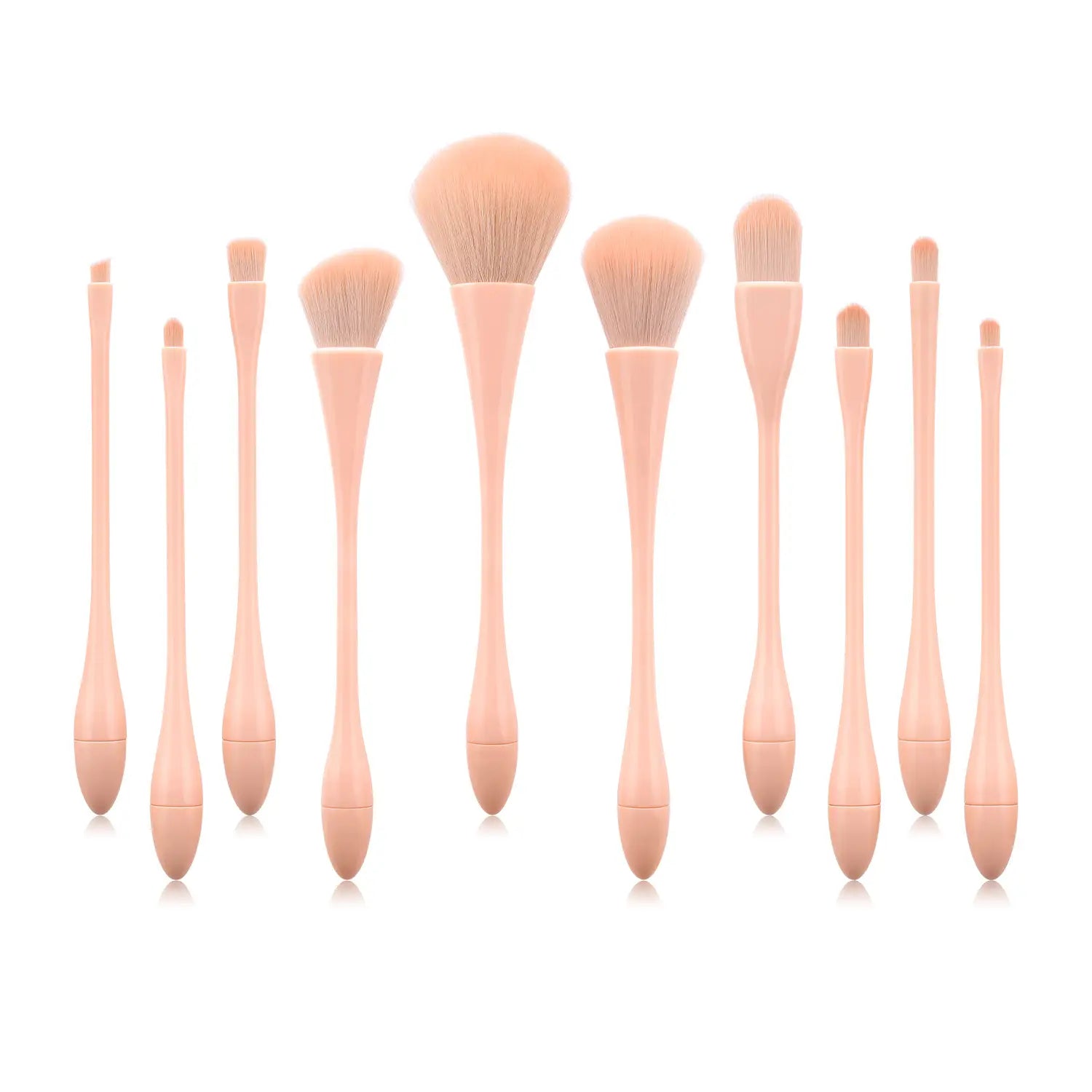 Set of ten professional nylon blush and foundation makeup brushes with peach-colored handles and soft tapered bristles in a pink makeup brush set 10pc.