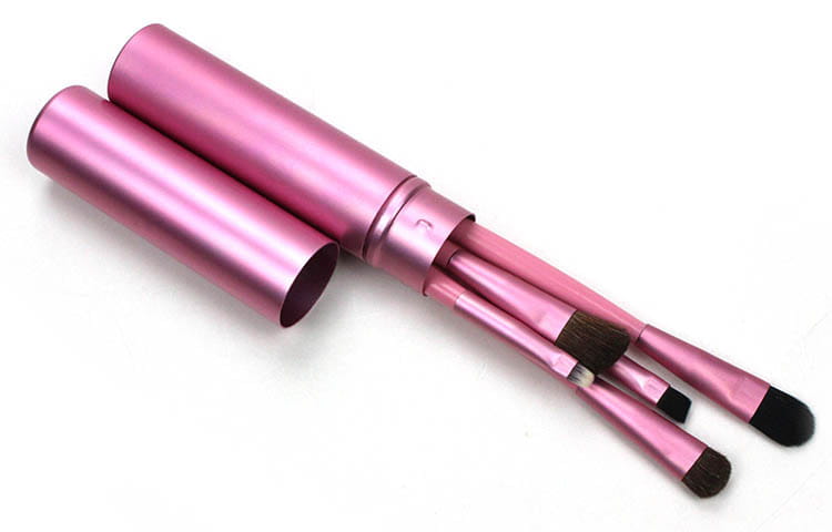 Travel eye makeup brush set featuring pink metallic cylindrical brushes with a matching portable case.