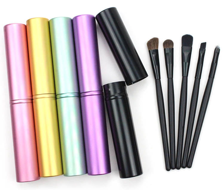 Set of six colorful metallic travel eye makeup brush cases with black brushes for portable use.