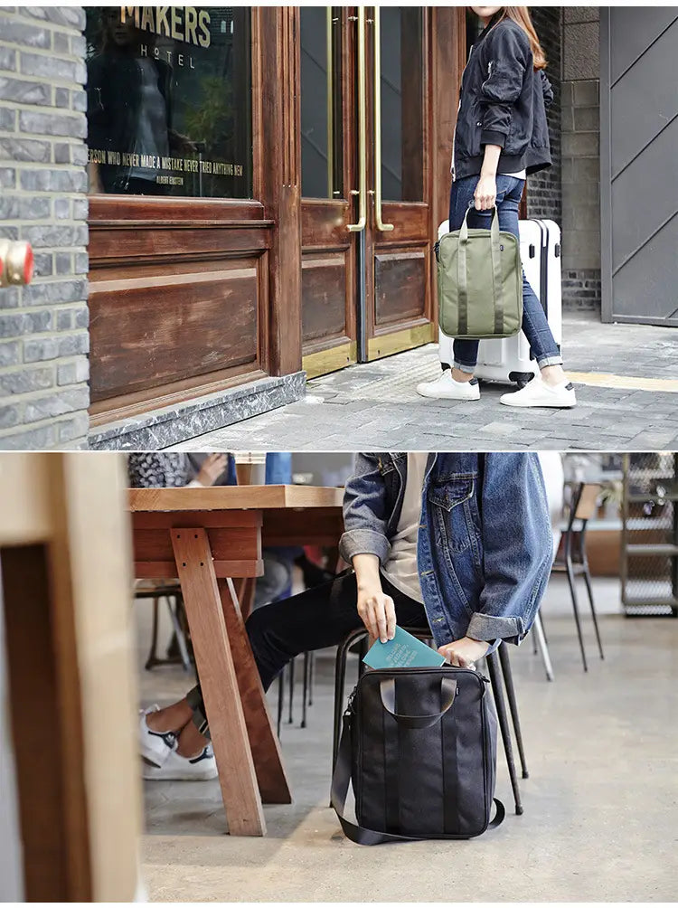 Olive green travel bag made of cotton canvas with black shoulder strap and top handle designed as a storage cube organizer.