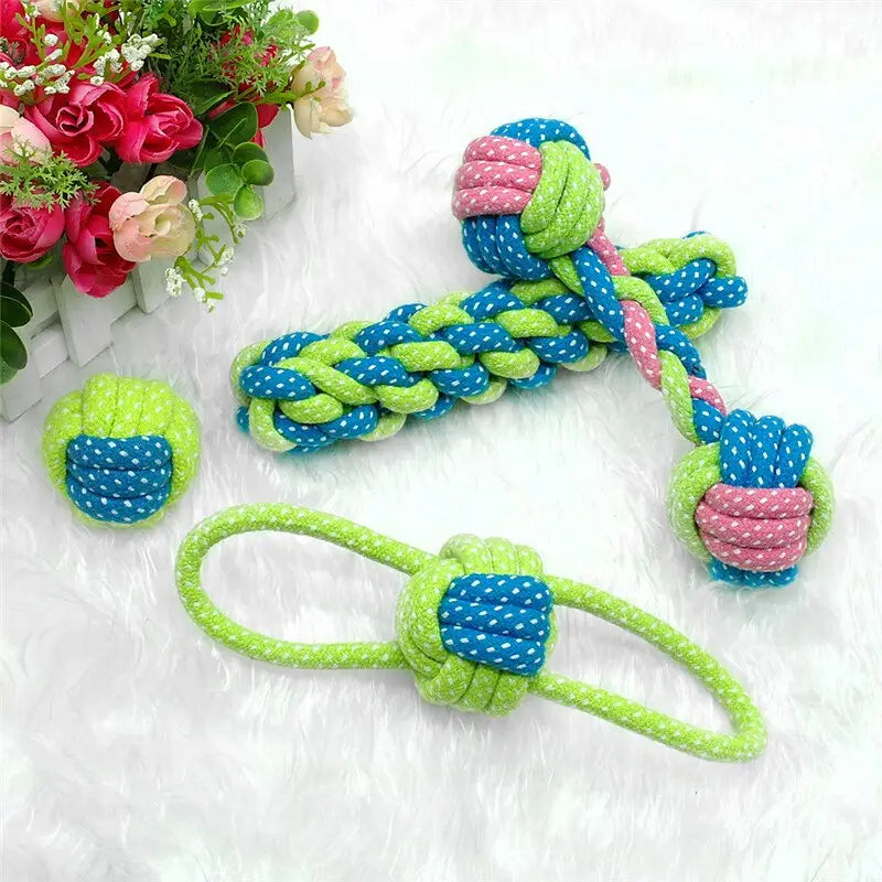 Dog rope toys for small and medium dogs featuring brightly colored green blue and pink woven patterns.
