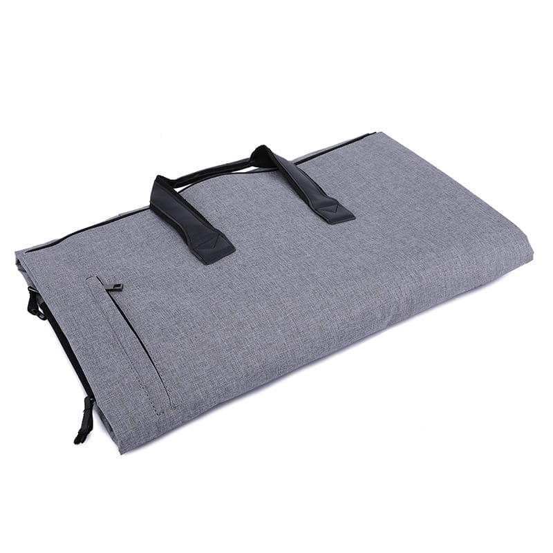 Convertible garment travel bag made of gray textured fabric featuring black handles and zipper accents with a shoe pocket.