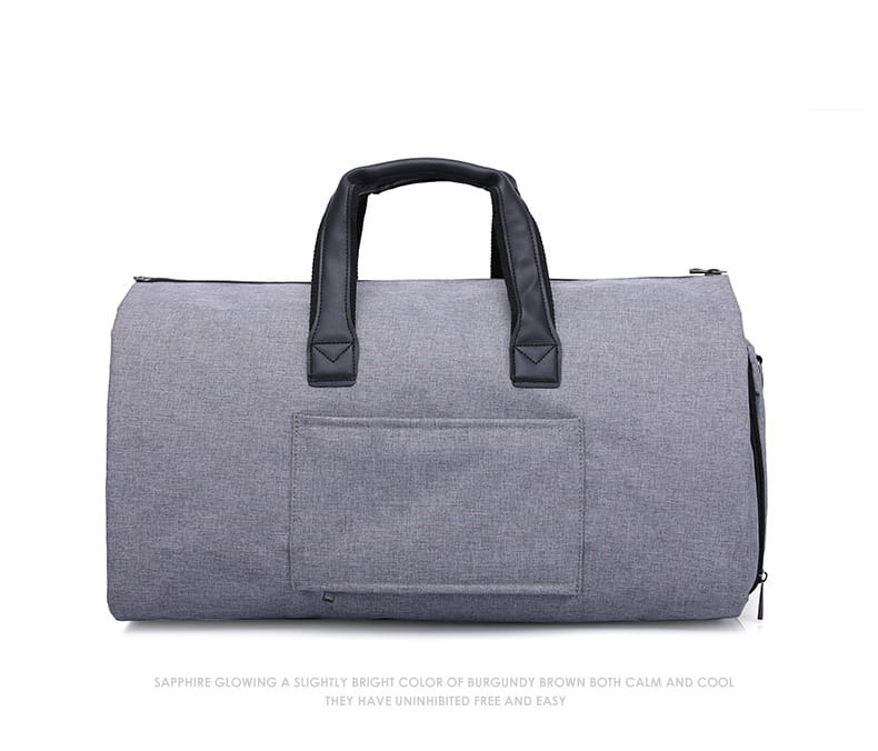 Gray textured fabric convertible garment travel bag with black leather handles and front pocket including a shoe pocket.