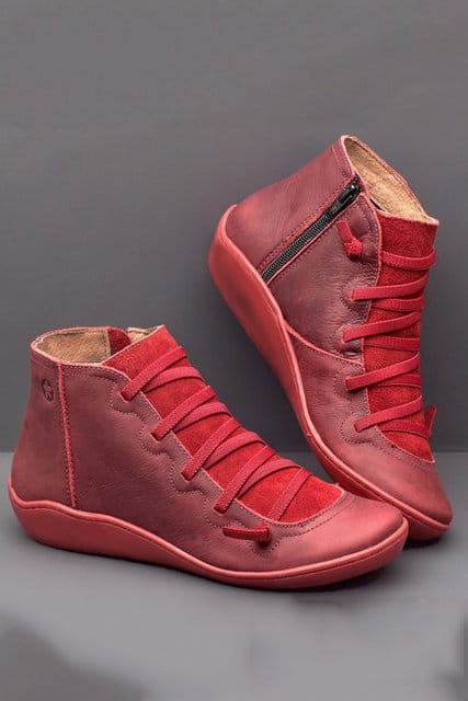 red suede high-top sneakers with matching laces and a side zipper are featured alongside snake print wedge ankle boots for women.