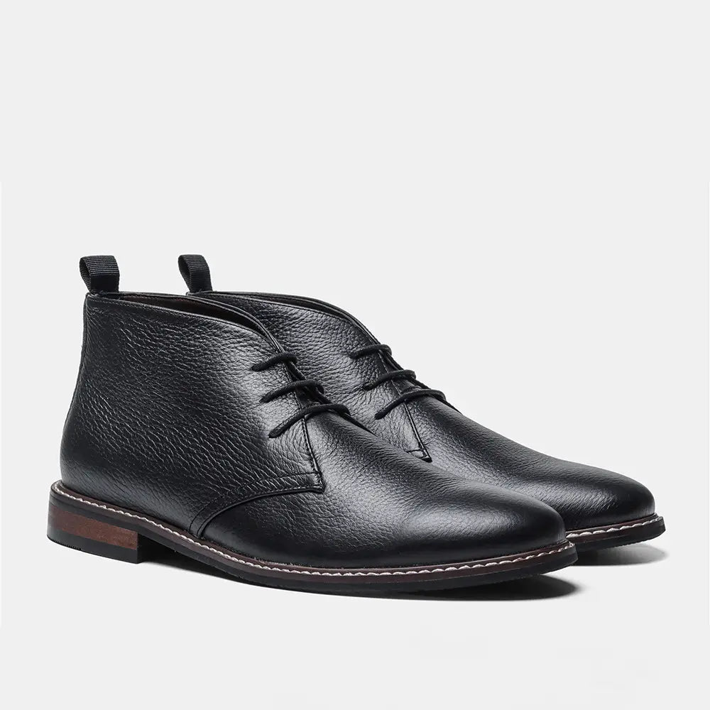 Men’s lychee pattern cowhide Chelsea Martin boots in black leather with pebbled texture and white sole stitching