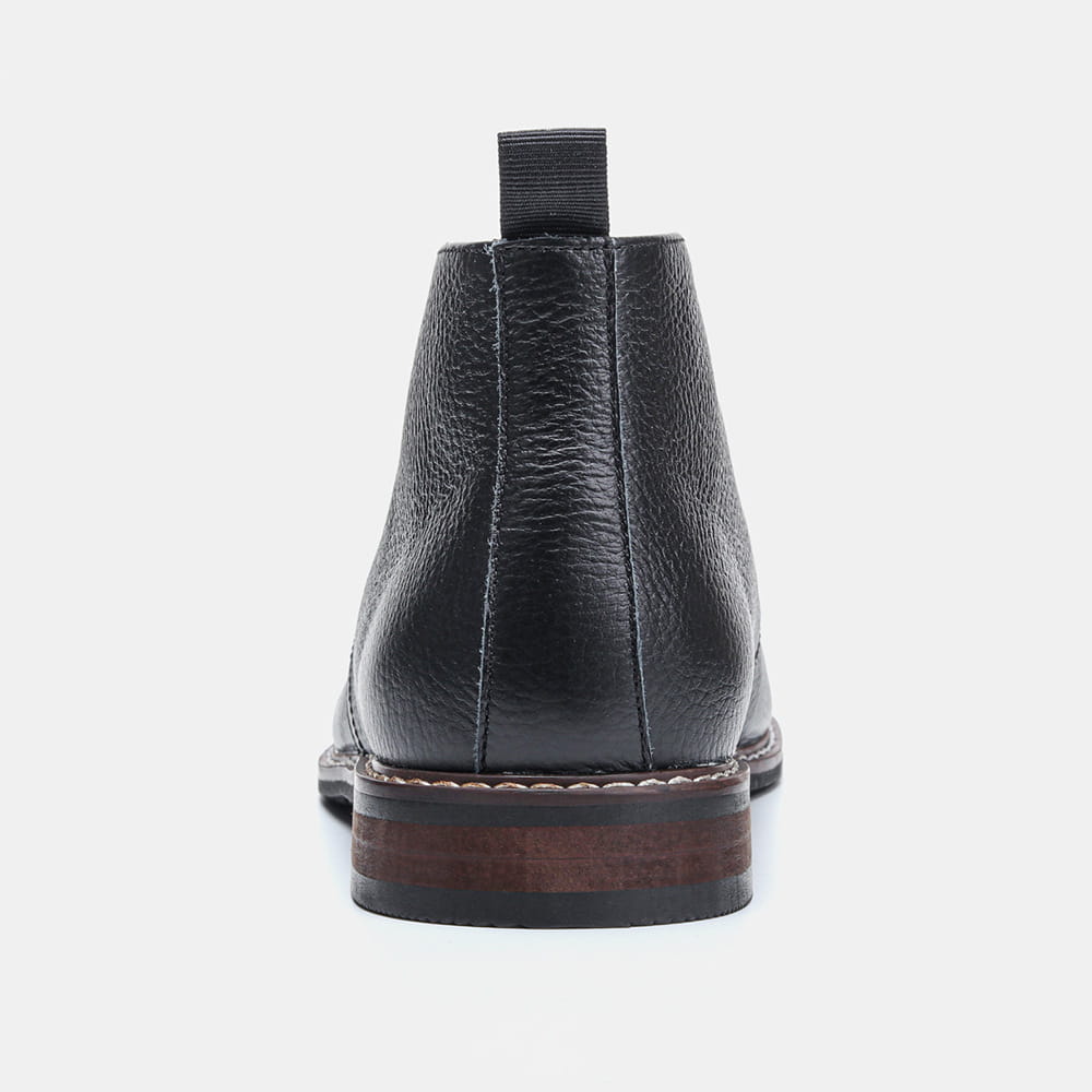 Men’s lychee pattern cowhide Chelsea Martin boots in black leather with pebbled texture and white sole stitching