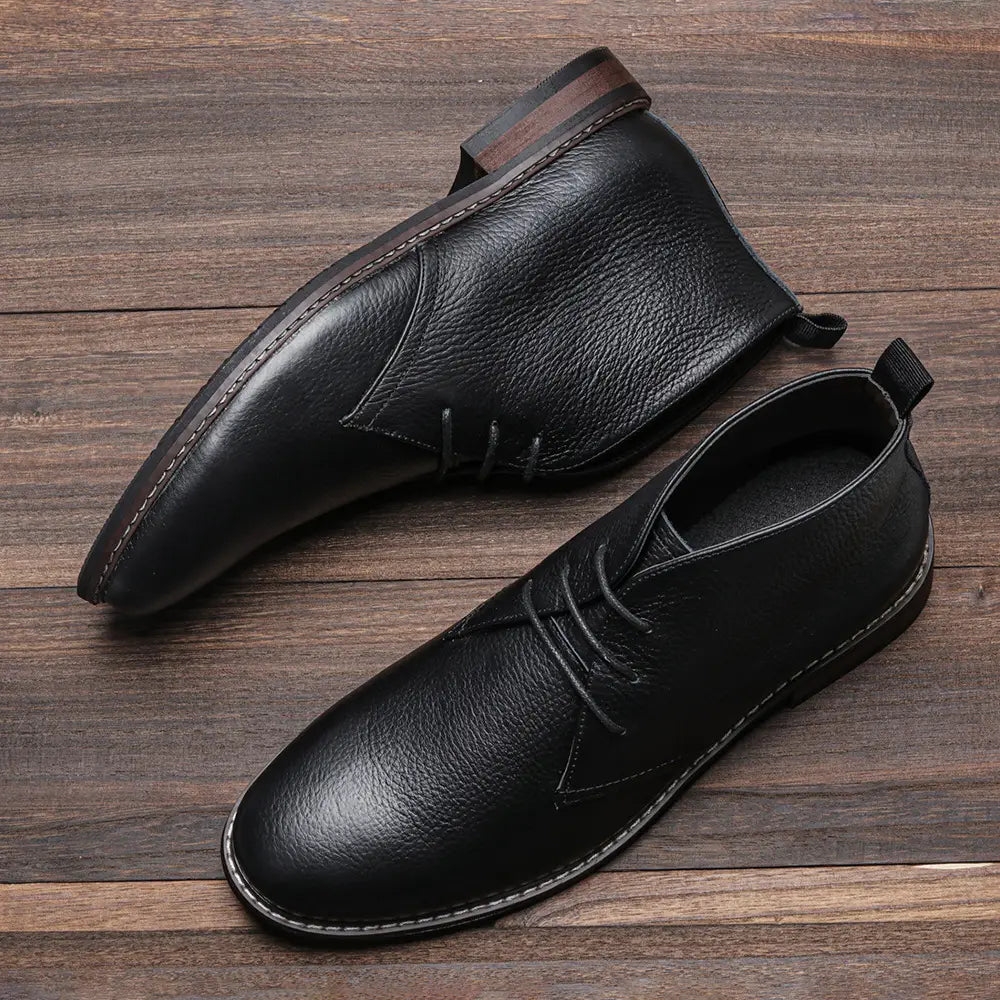 Men’s lychee pattern cowhide Chelsea Martin boots in black leather with pebbled texture and white sole stitching