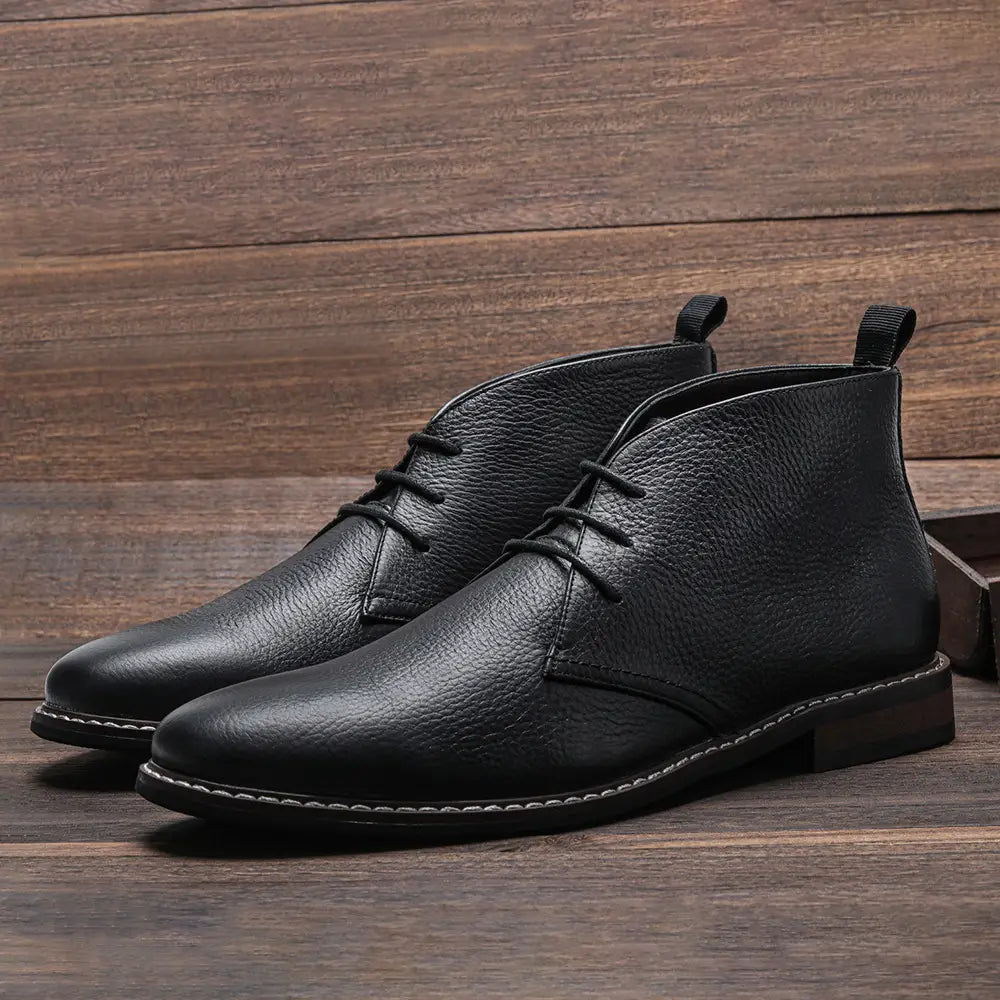 Men’s lychee pattern cowhide Chelsea Martin boots in black leather with pebbled texture and white sole stitching