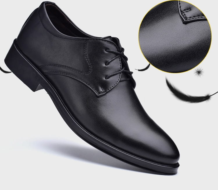 Men’s black pointed toe leather oxford dress shoe featuring a polished finish and classic lace-up design.