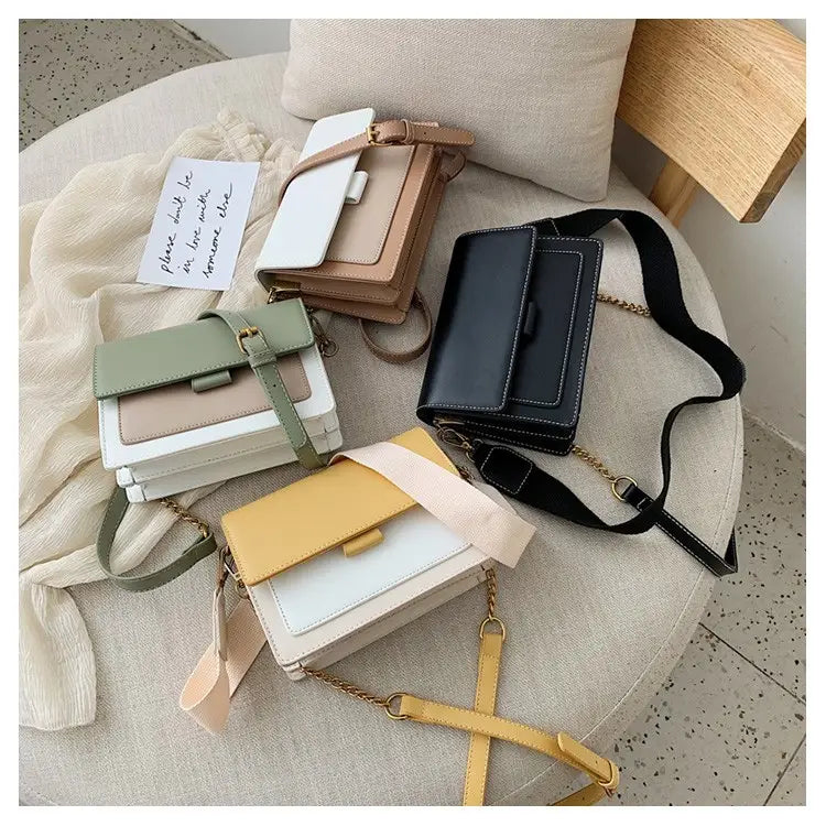 A collection of square crossbody bags in pastel and neutral tones featuring two-tone faux leather and gold chain straps with contrasting flap closures.