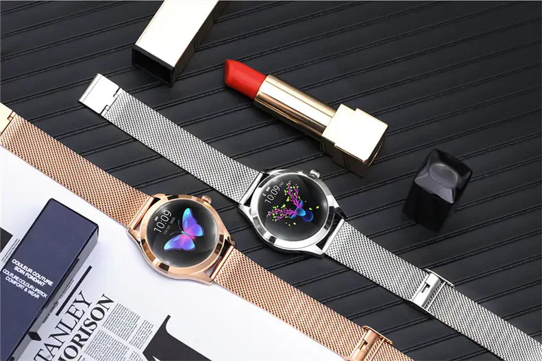 Two smartwatches with circular butterfly-themed digital displays featuring rose gold and silver stainless steel mesh bands for elegant wearable technology.