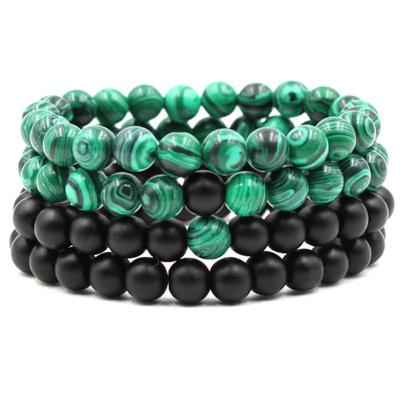 matte black and green malachite elastic bead bracelet featuring stacked malachite and black beads with swirling green patterns.