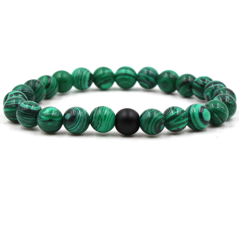 Matte black and green malachite elastic bead bracelet featuring green malachite beads with a single black accent bead.