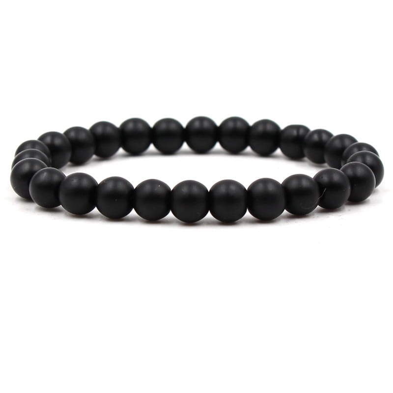 Matte black and green malachite elastic bead bracelet featuring smooth black beaded stretch design with uniformly sized spherical beads.