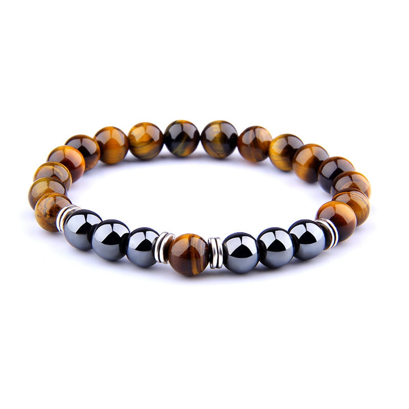 A stylish tiger eye and magnetic obsidian beaded elastic bracelet featuring alternating golden brown striped tiger eye beads and sleek black magnetic spheres accented by silver toned metal spacers.