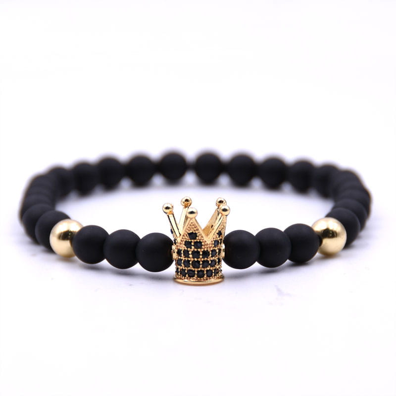 Luxury zircon crown matte black beaded bracelet featuring a gold crown charm adorned with black stones.