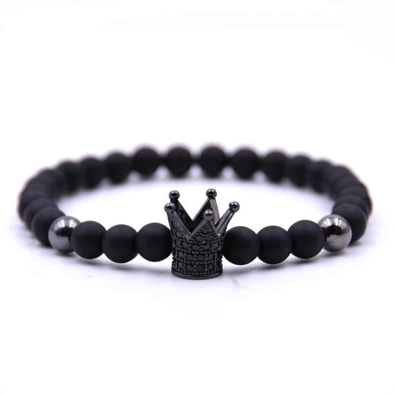 Luxury zircon crown matte black beaded bracelet featuring a central black crown charm with embedded stones and two metallic spherical beads.