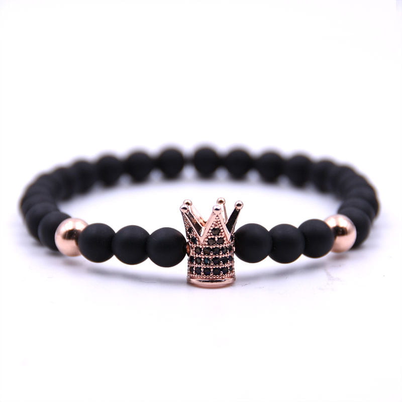 Luxury zircon crown matte black beaded bracelet featuring a black beaded band with a rose gold crown charm and accent beads.