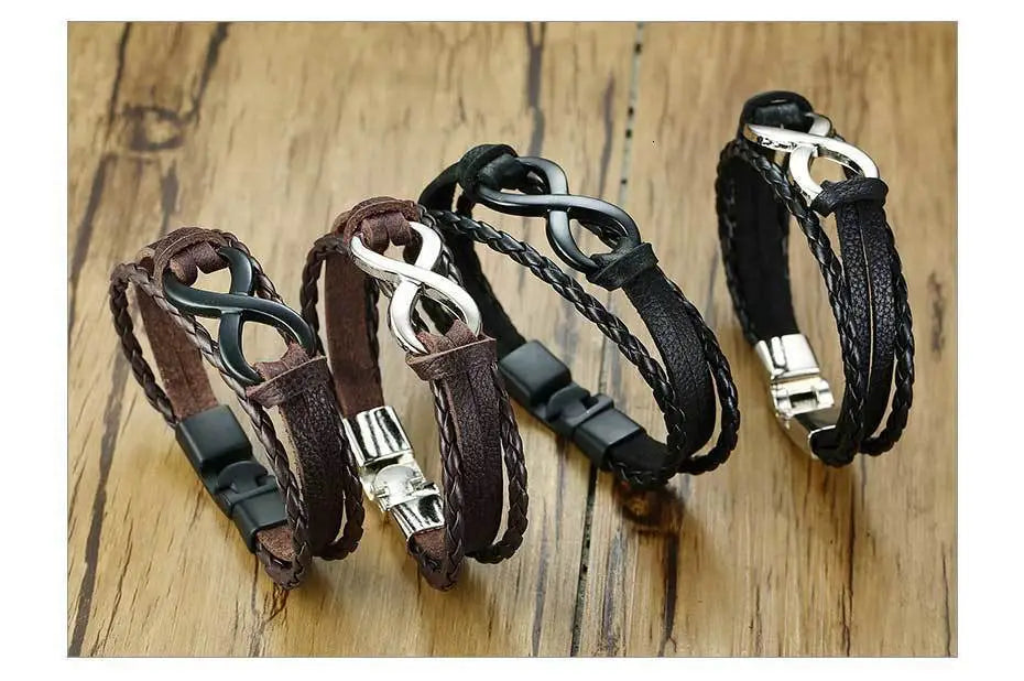 Set of three unisex braided leather infinity and nautical charm bracelets in brown and black with silver toned metal clasps.