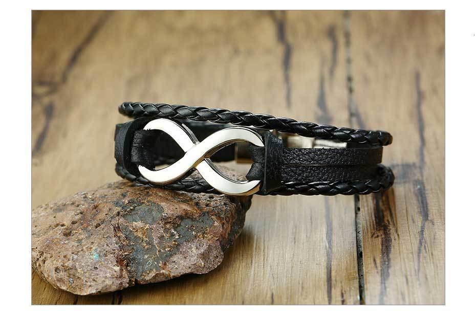 Black braided leather bracelet featuring a silver infinity symbol clasp from the unisex braided leather infinity and nautical charm bracelet collection.