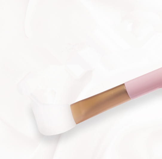 Pink and gold fan makeup brush with a soft white bristle head and iridescent gradient handle from the 3pc fan makeup brush set.