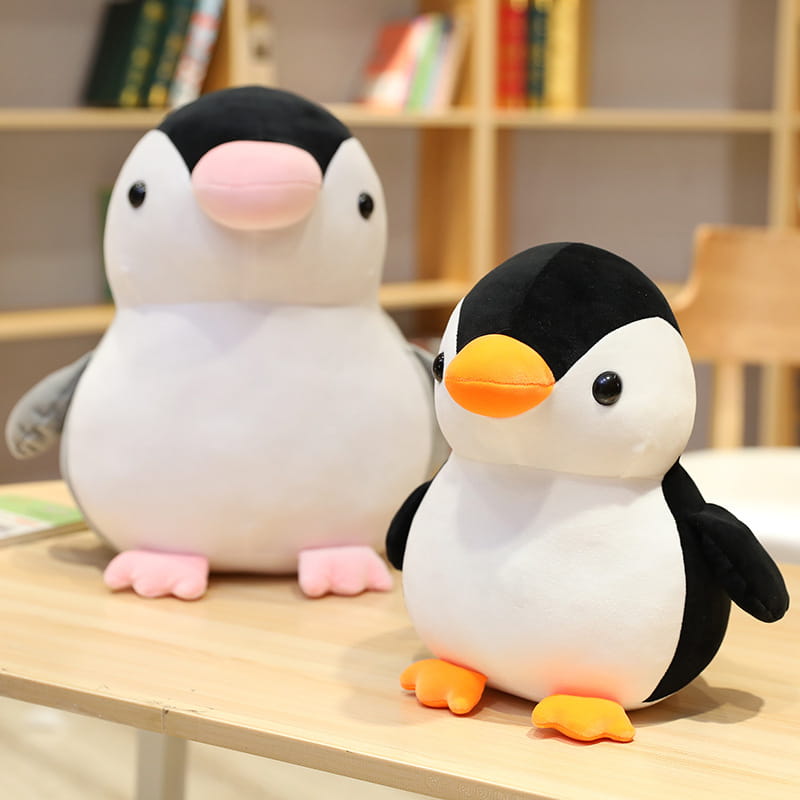 Niedliches Pinguin-Plüschspielzeug in Schwarz und Weiß mit pinken und orangefarbenen Schnäbeln und Füßen aus weichem Stoff für Kinder und Jugendliche.