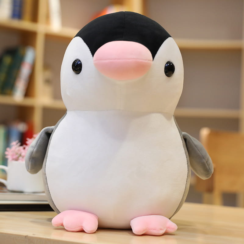 Niedliches Schwarz-Weiß-Plüsch-Pinguin-Spielzeug mit pinkem Schnabel und pinken Füßen aus weichem Stoff, ideal für Kinder und Jugendliche.