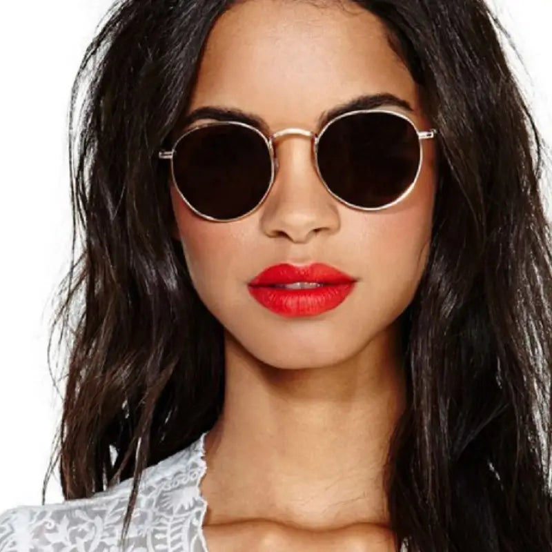 Round gold-framed sunglasses with dark lenses from the rose gold and metallic aviator mirror lens sunglasses set.