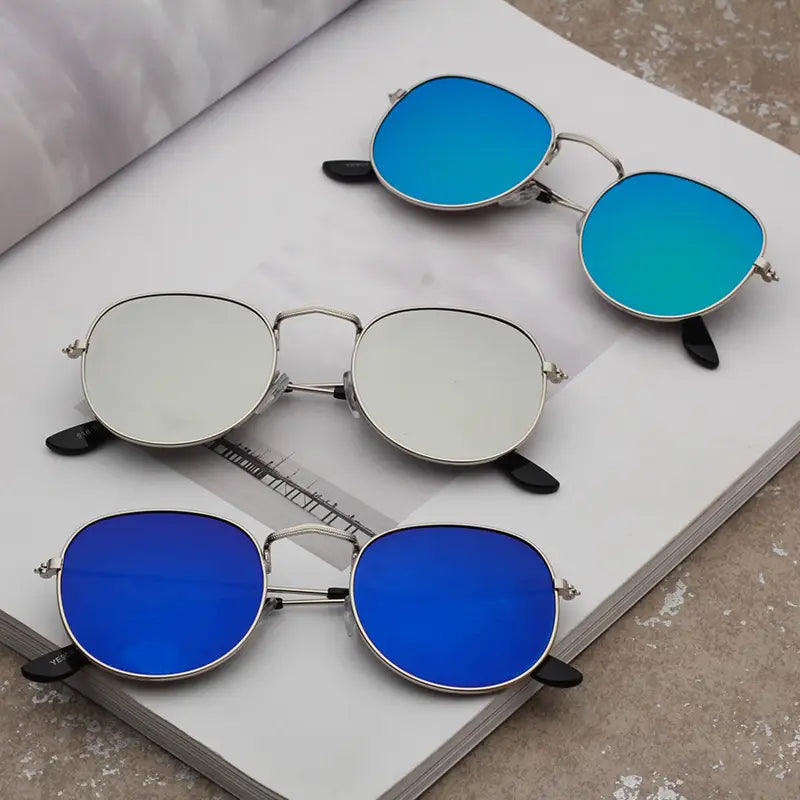 Set of three rose gold and metallic aviator mirror lens sunglasses featuring round frames with blue and silver reflective lenses and black temple tips.
