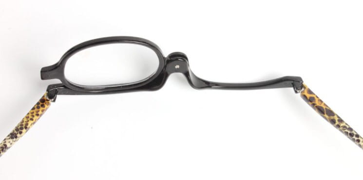 Black-framed folding makeup reading glasses with leopard-print temple arms and plus 2.50 strength variety pack.