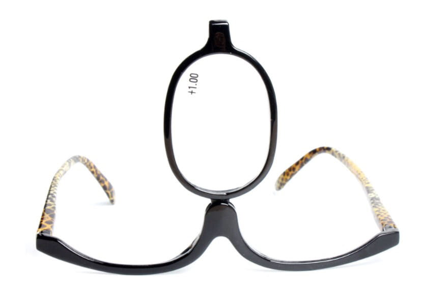 Black-framed makeup reading glasses with leopard-print temple arms and plus 1.00 lens strength from a plus 2.50 strength variety pack.