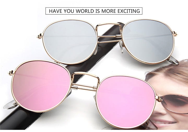 Retro round gold metal mirrored sunglasses featuring gold-rimmed round frames with silver and pink mirrored lenses.