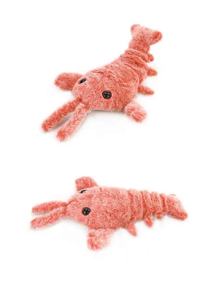 Korallenfarbenes Plüsch-Elektrisch-hüpfendes Hummer-USB-Lade-Katzen-Spielzeug mit schwarzen Knopfaugen und weicher flauschiger Textur.