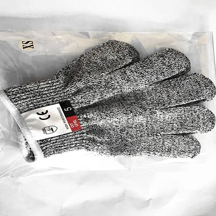 cut resistant work gloves hppe safety gloves in gray and black speckled knit material packaged in a clear plastic bag labeled size xs
