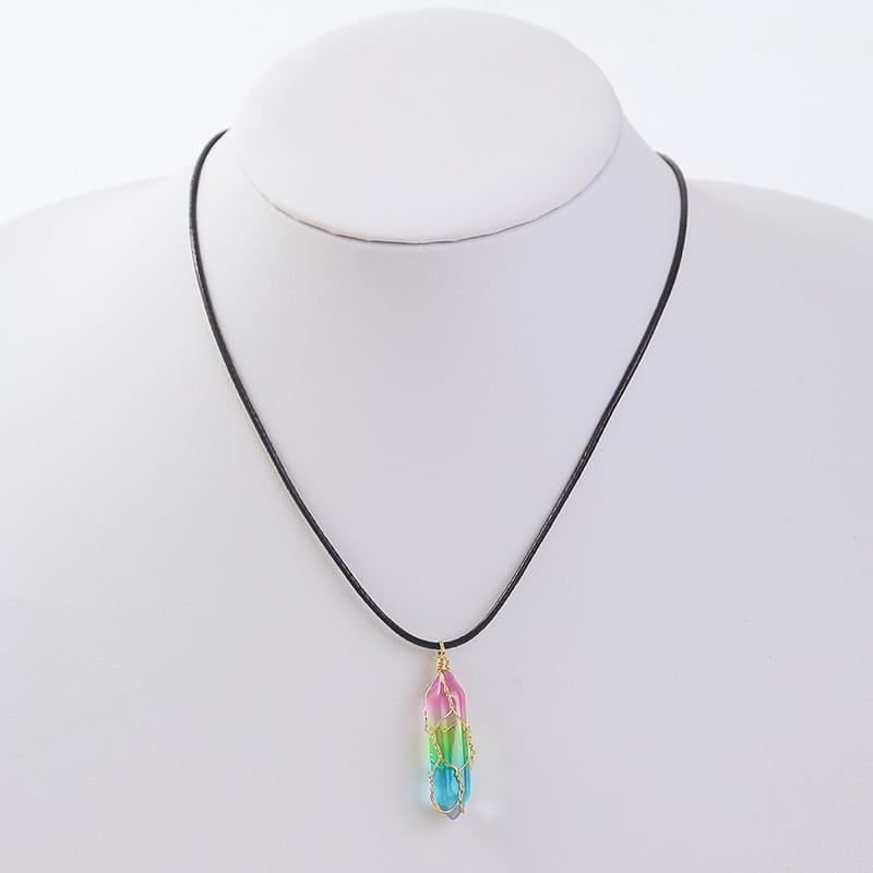 A vibrant rainbow-colored geometric crystal wire wrapped pendant necklace hanging from a black cord.