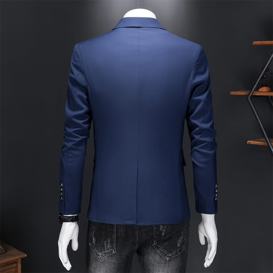 Chaqueta de vestir empresarial de pana azul marino con ajuste slim, brillo sutil y puños abotonados.