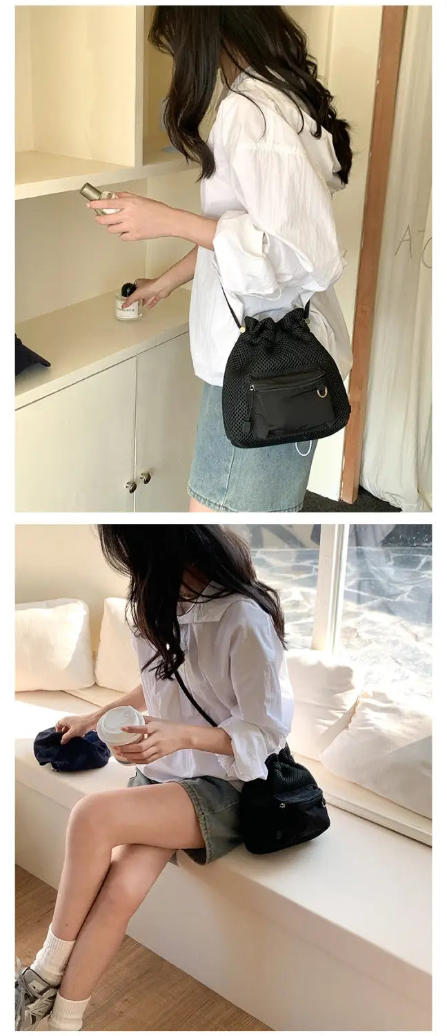 black textured drawstring shoulder bag featuring a mini pink mesh bucket design with a heart charm