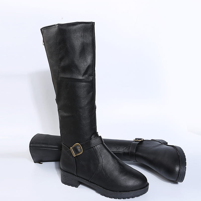 Black leather knee high knight boots with a matte finish and gold-toned buckle strap accents.