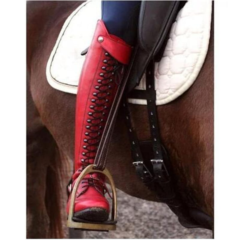 Over the knee red leather studded riding boot with black lacing and silver eyelets.