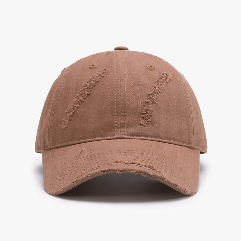 Tan distressed baseball cap for men with frayed fabric details and a curved brim made of ripped cotton.
