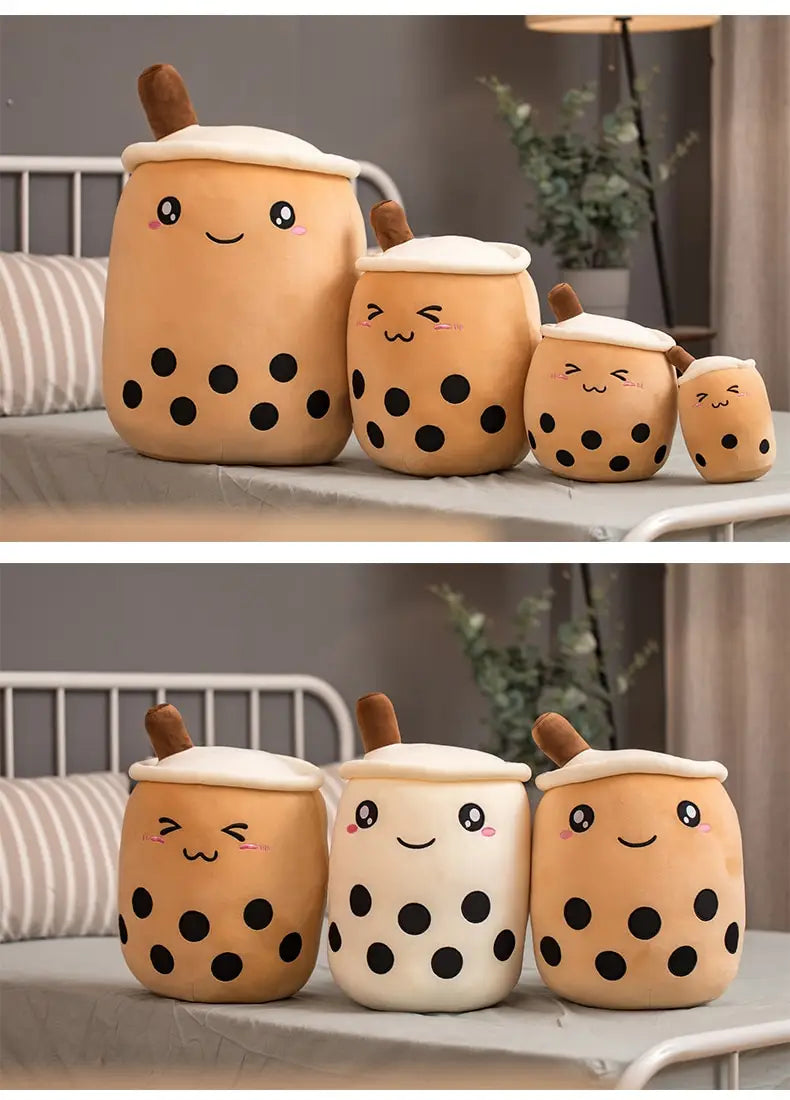 Cute beige and white boba tea plush soft bubble tea pillow toys featuring black tapioca pearls smiling faces and brown straws.