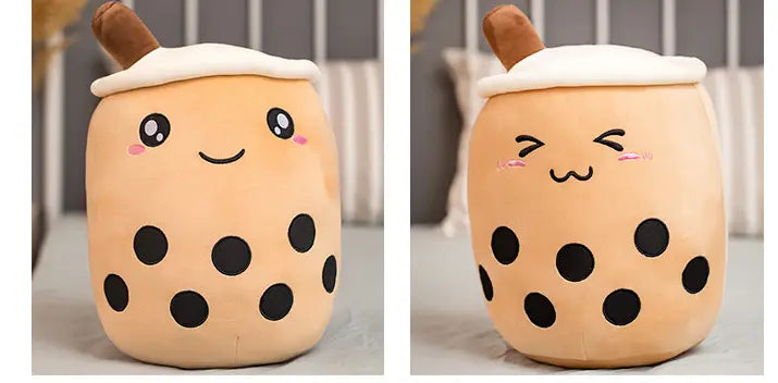 Cute beige plush boba tea pillow toy featuring black tapioca pearls and a brown straw made of soft material for decorative and comfort use.