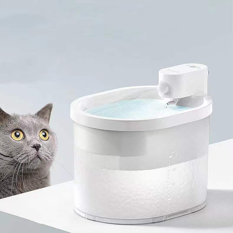 White plastic cat automatic water dispenser wireless pet fountain with clear reservoir and measurement markings.